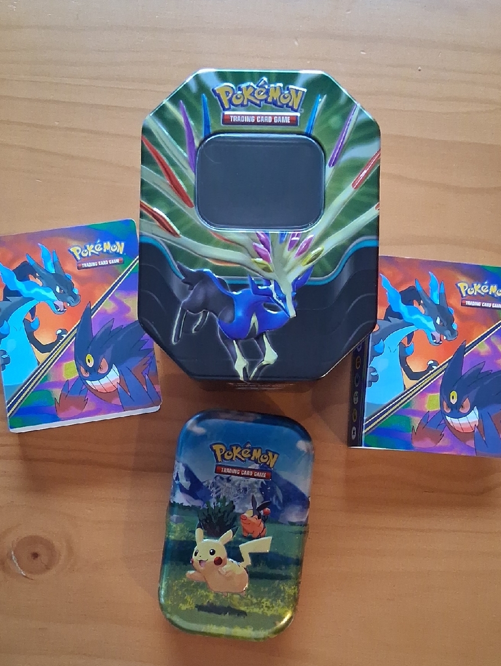 Pokemon Tin Set with Green, Blue, Purple, Yellow Artwork